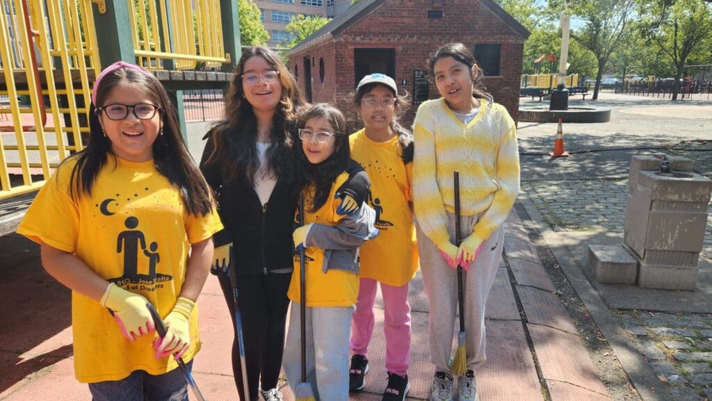 a group of girls wearing matching yellow outfits