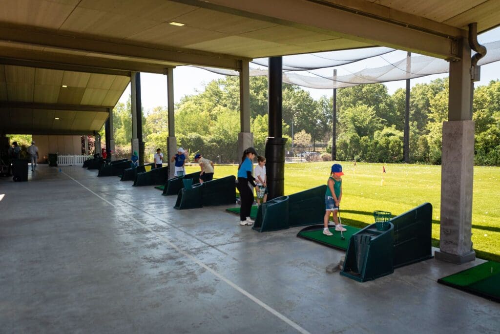 golf center with kids hitting golf balls