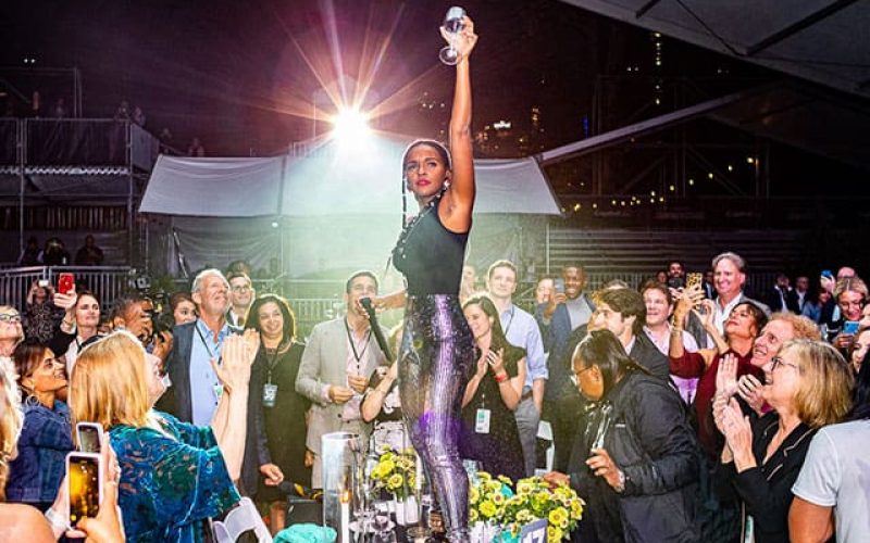 Thumbnail image: Janelle Monae standing on a table at the CPF 30th Gala